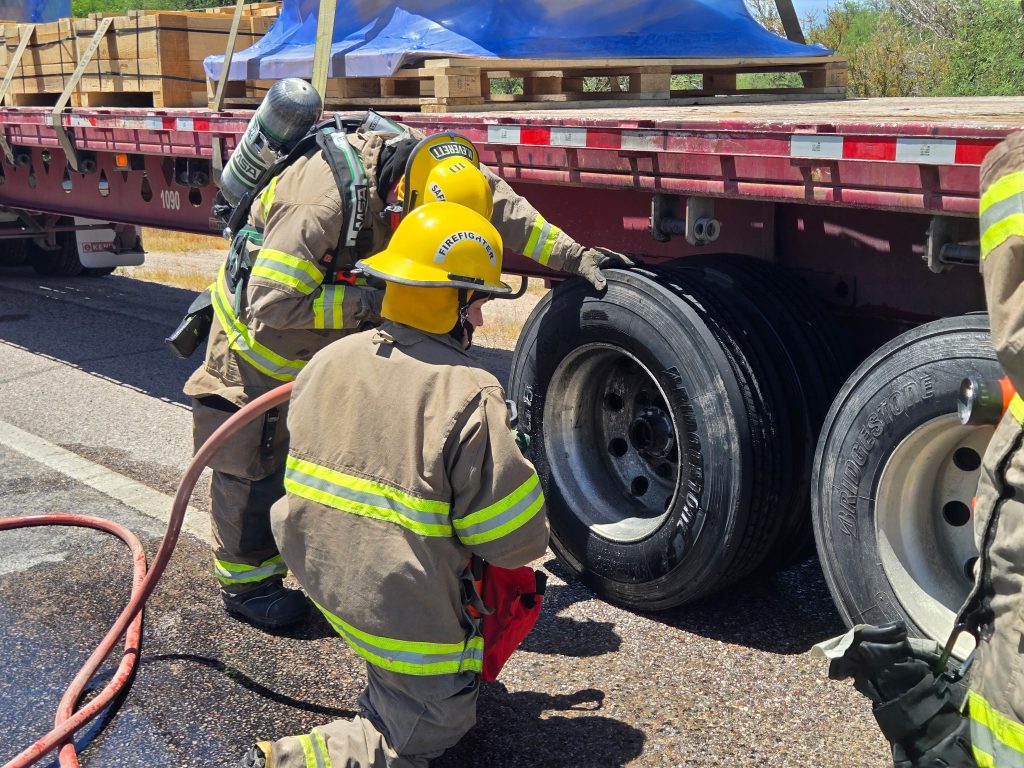 Saint David Fire District members training to check for heat and properly cool vehicle brakes during a brake fire.