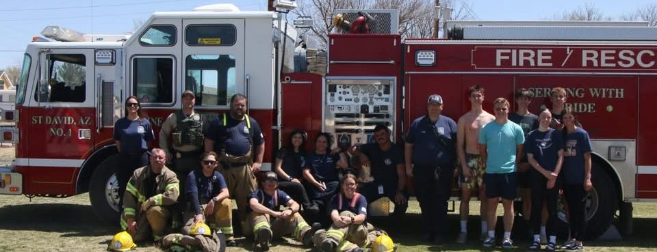 Responders gathered in front of a fire engine during the 2025 pre-prom mass casualty incident demonstration.