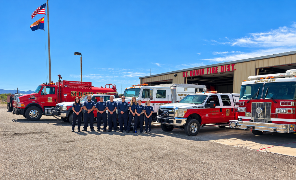 Saint David Fire District members standing with emergency vehicles outside Station 28.